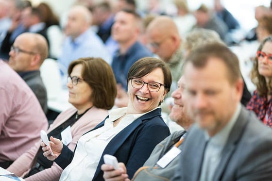 Attendee laughing at event