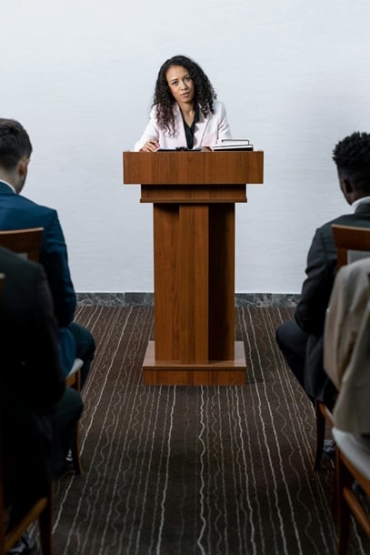 Woman speaking at lecturn